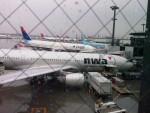 A wet arrival into NRT.  The Delta 777 brought me to Tokyo.  This ship, named soaring spirit, brought the olymplic flame to Salt Lake City.